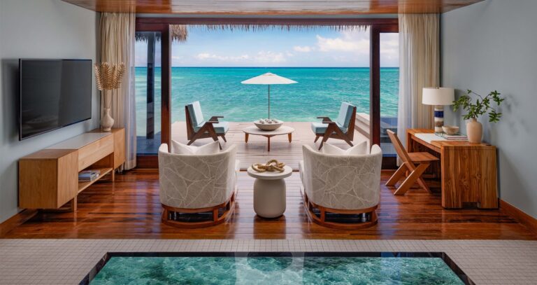 An overwater bungalow interior, glass-floor panel and sea-view deck, Sandals Royal Caribbean Resort and Private Island