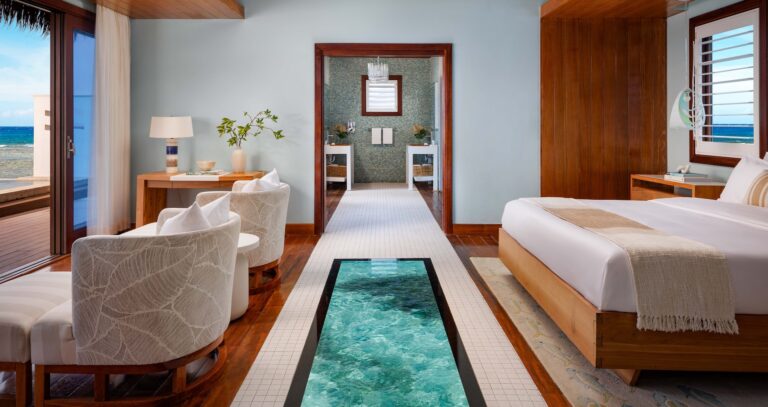 Suite bedroom and sitting area with a glass-floored walkway, Sandals Royal Caribbean Resort and Private Island