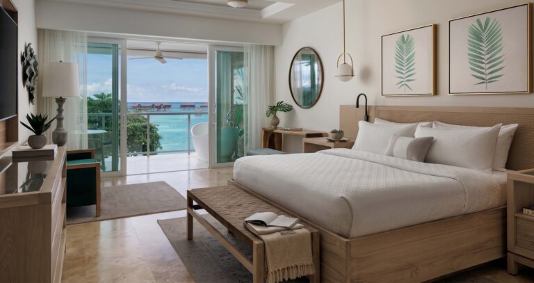 Bedroom with sliding doors to a balcony and bath, Sandals Royal Caribbean Resort and Private Island