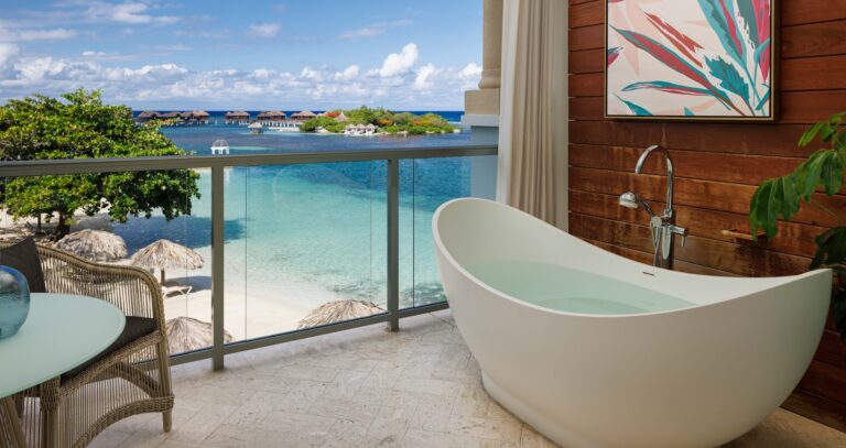 Balcony with a freestanding bath overlooking the beach and the private island, Sandals Royal Caribbean Resort and Private Island