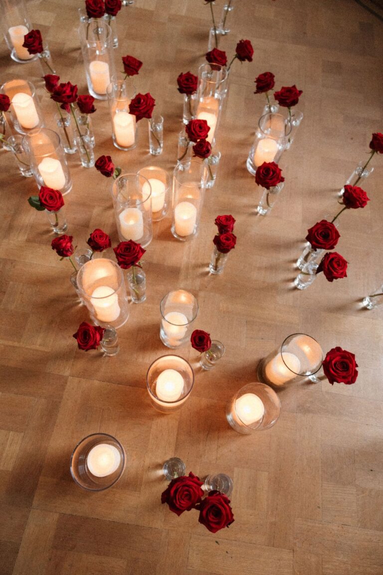 Candles and red roses arranged on a parquet floor, Waldorf Astoria Amsterdam, Sante Weddings