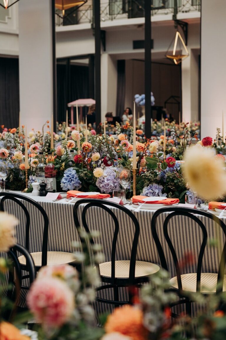 Long reception table with abundant flowers, Anantara Grand Hotel Krasnapolsky, Amsterdam, Sante Weddings