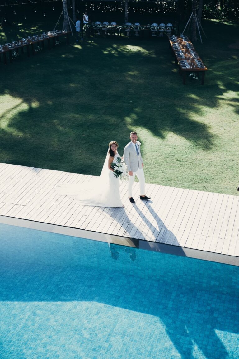 Couple on the edge of a villa pool, Bali, Sante Weddings
