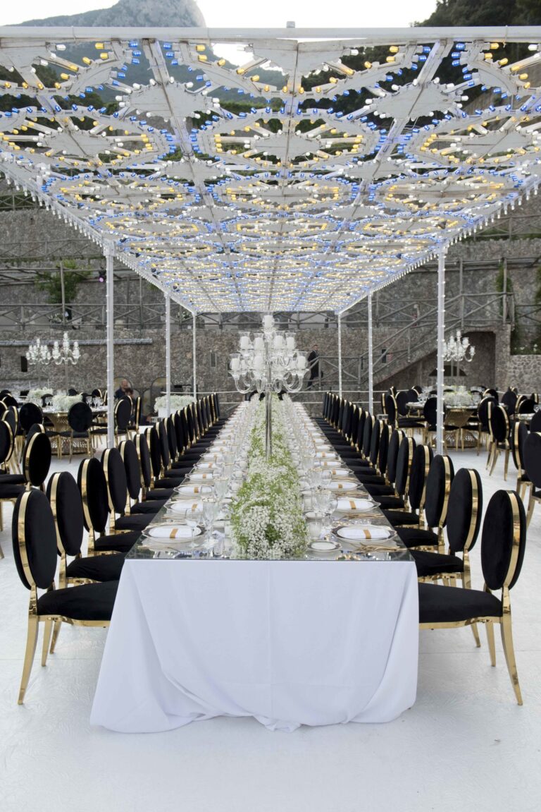Long table under a lit floral ceiling at I Giardini del Fuenti, Amalfi Coast, Sara D'Angelo