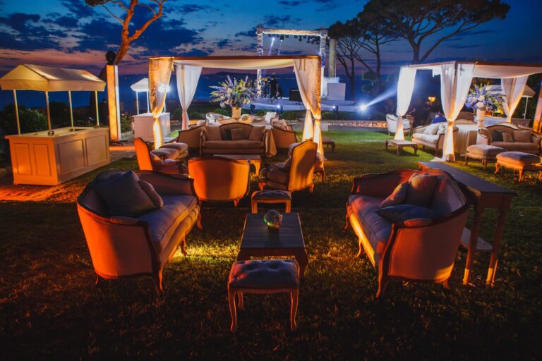 Lounge furniture and candlelit cabanas on a garden terrace at dusk, Villa Angelina, Sorrento, Sara D'Angelo