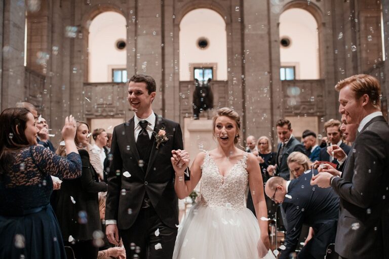 Couple leaving the ceremony amid confetti, Sarah Linow