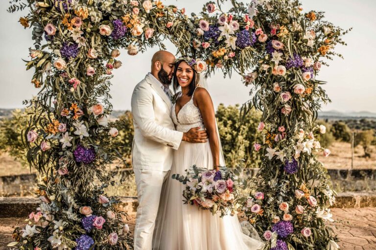 Couple beneath a wild flower arch, Mallorca, Sarah Linow