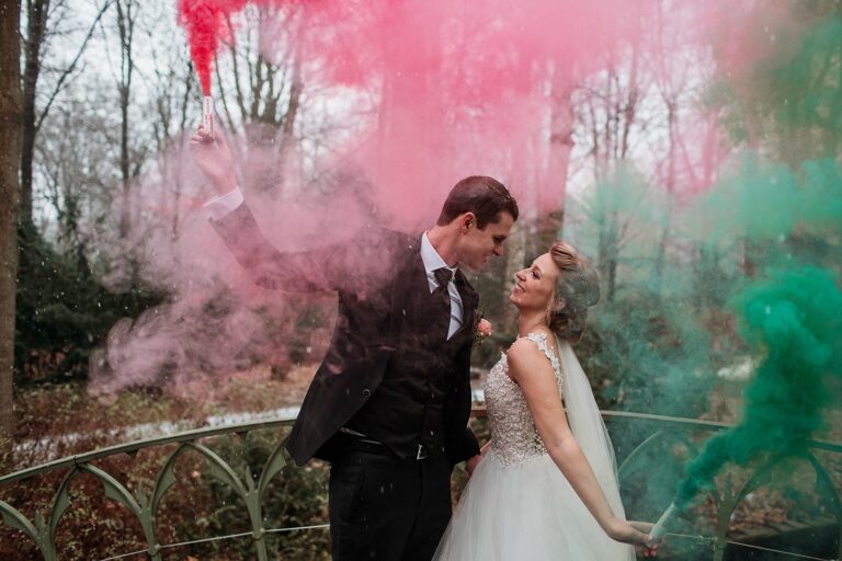 Couple among coloured smoke in a Berlin park, Sarah Linow