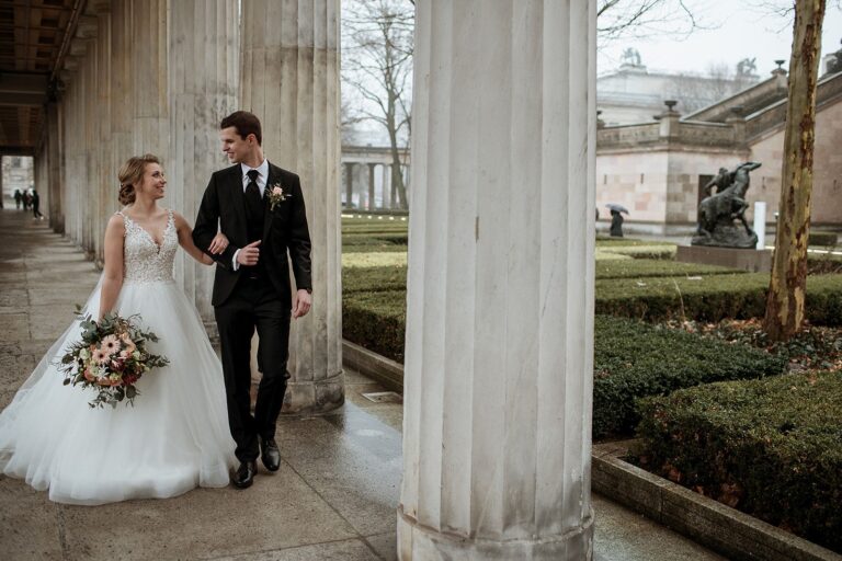 Couple walking through a colonnade, Berlin, Sarah Linow