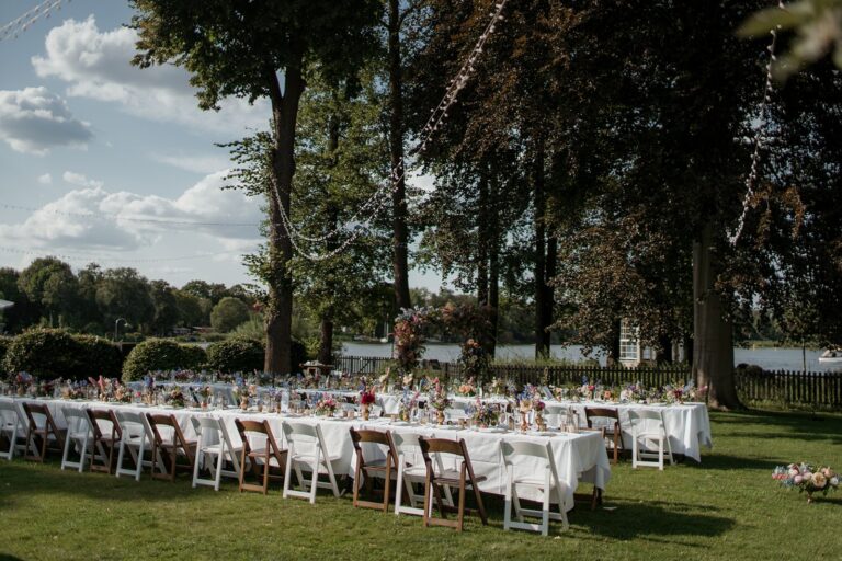 Long banquet table on a lakeside lawn near Potsdam, Sarah Linow
