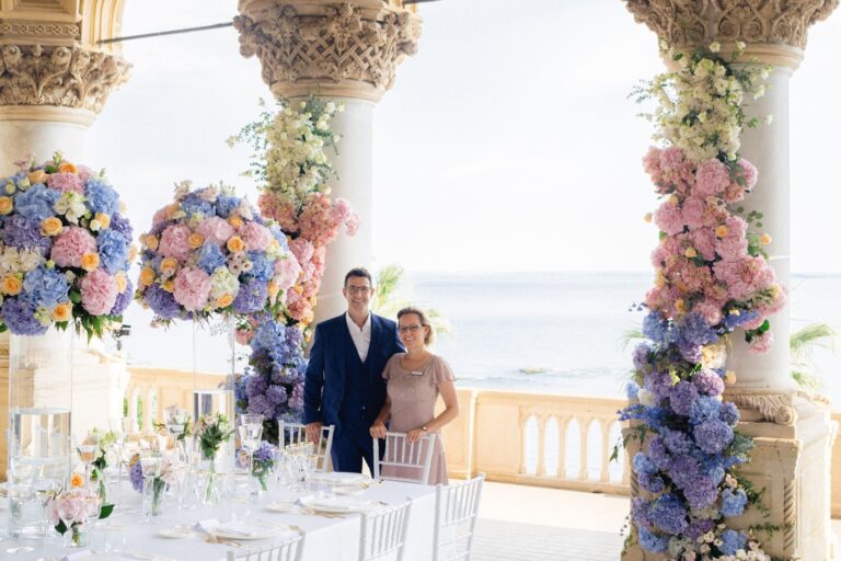 Terrace wedding set-up with pastel floral columns above the lake, Italy, Sarah Linow