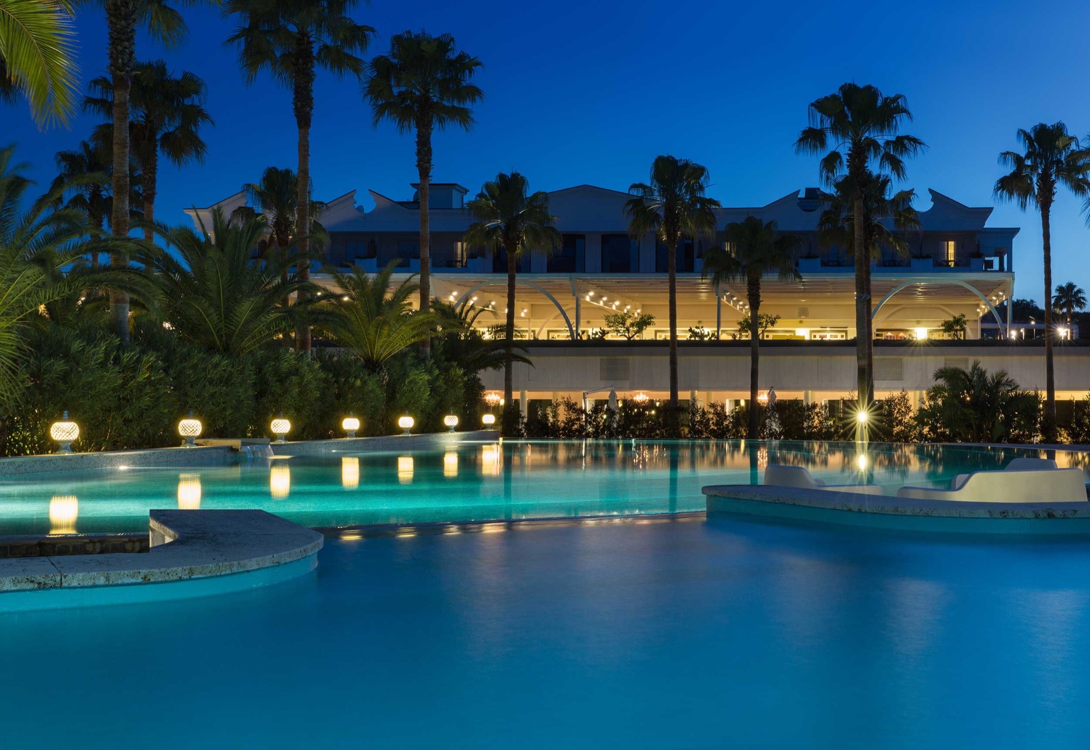 The Savoy Hotel & Spa at night, the pool lit in the garden, Savoy Hotel & Spa