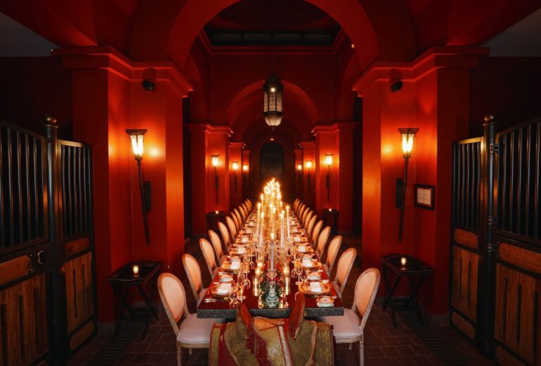 Long banquet table set inside the stables, Selman Marrakech