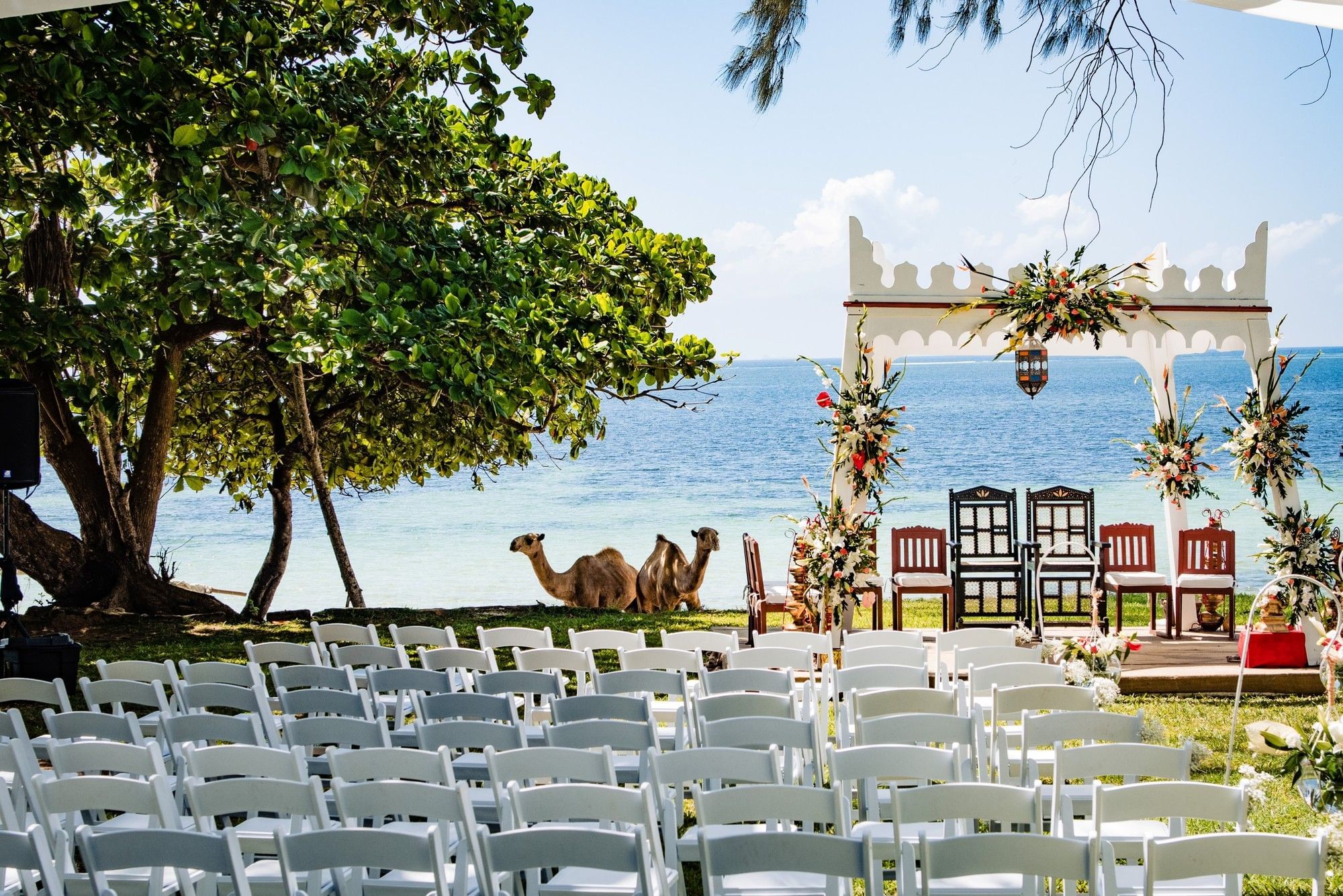 Beach wedding ceremony set up with a carved arch facing the Indian Ocean, Serena Beach Resort & Spa