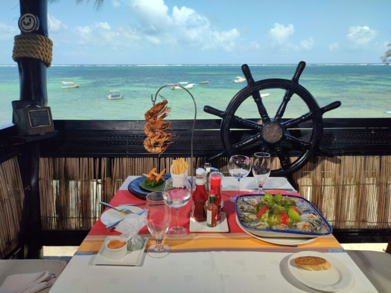 Seafood table at the dhow-inspired Jahazi Grill with ocean views, Serena Beach Resort & Spa