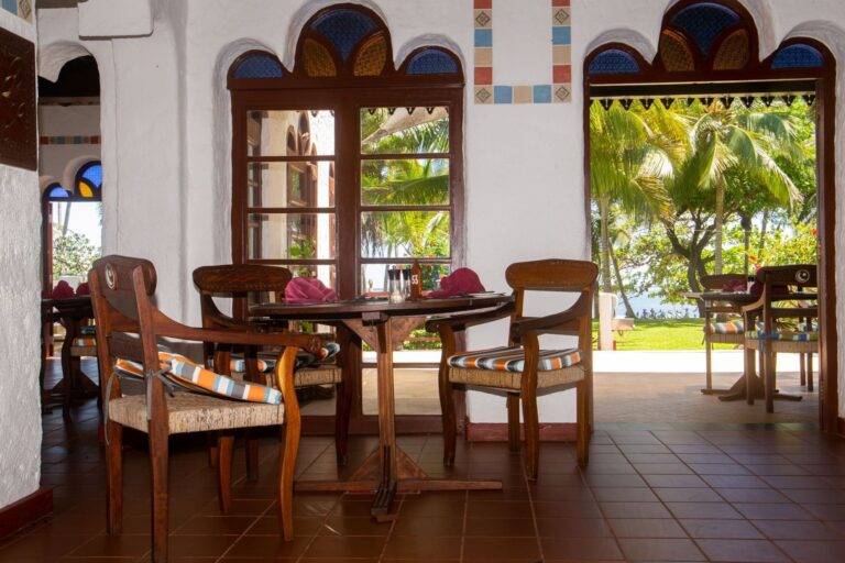Table by the open arches of The Fountain Restaurant, Serena Beach Resort & Spa