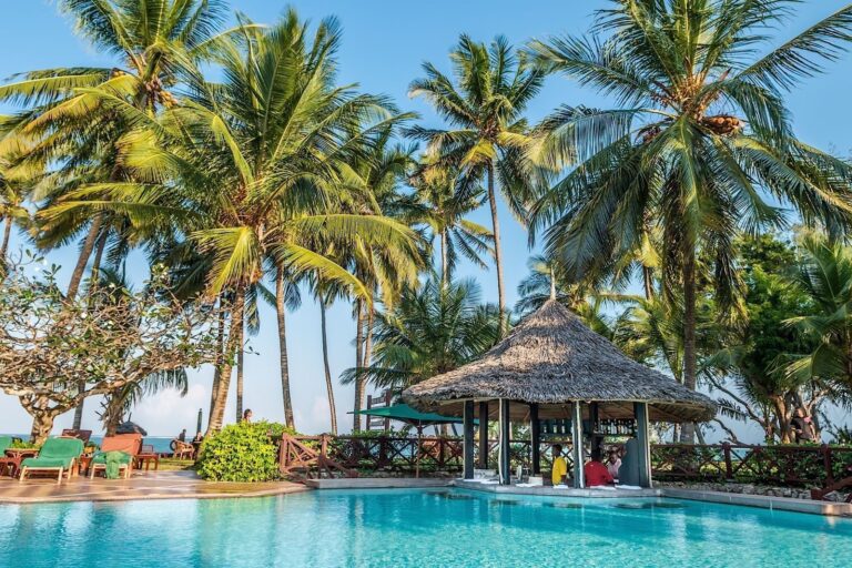 The swim-up pool bar beside the palm-fringed pool, Serena Beach Resort & Spa