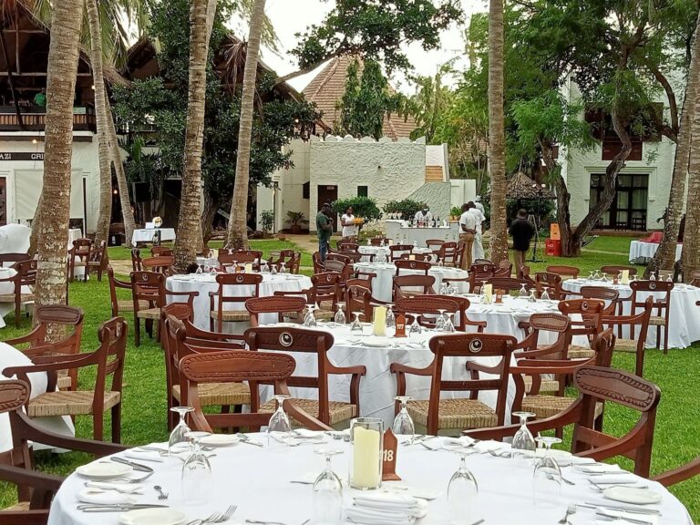 Wedding reception tables laid on the garden lawn, Serena Beach Resort & Spa