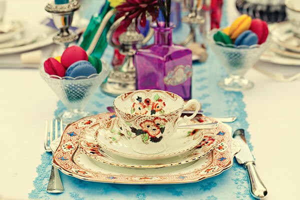 Colourful china setting with macarons and a bright table runner, Serendipity Street