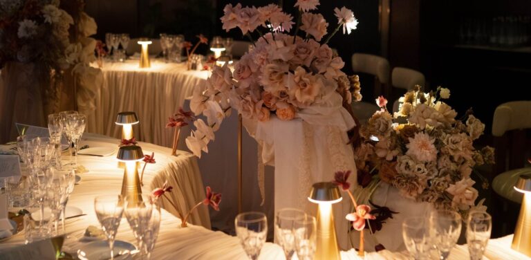 Reception tables dressed with pale flowers, table lamps and crystal glassware, Shangri-La Hotel, The Shard, London