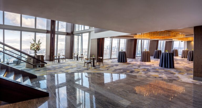 The level 34 event floor with its glass staircase, marble floor and cocktail tables against the windows, Shangri-La Hotel, The Shard, London