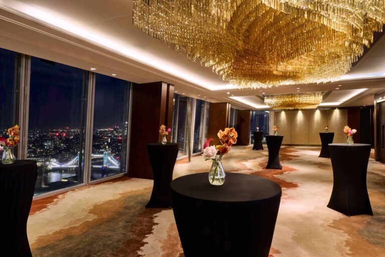 The Ren Room laid out for a standing reception at night, with Tower Bridge lit below, Shangri-La Hotel, The Shard, London
