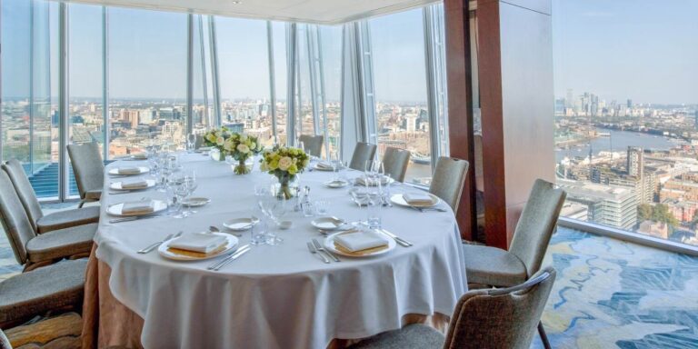 The Yi Room, a small corner room laid for dinner with views east along the river, Shangri-La Hotel, The Shard, London