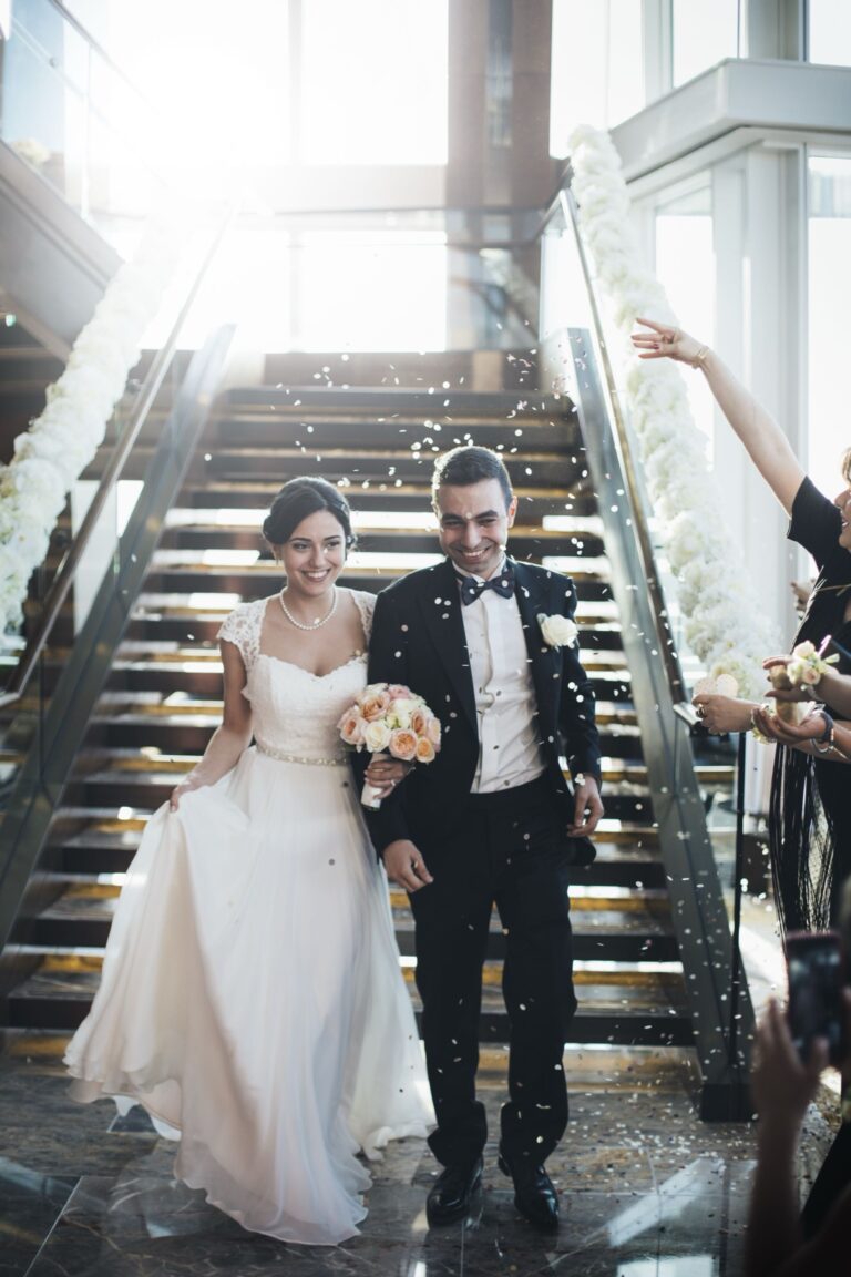A couple coming down the grand staircase under a shower of confetti, Shangri-La Hotel, The Shard, London