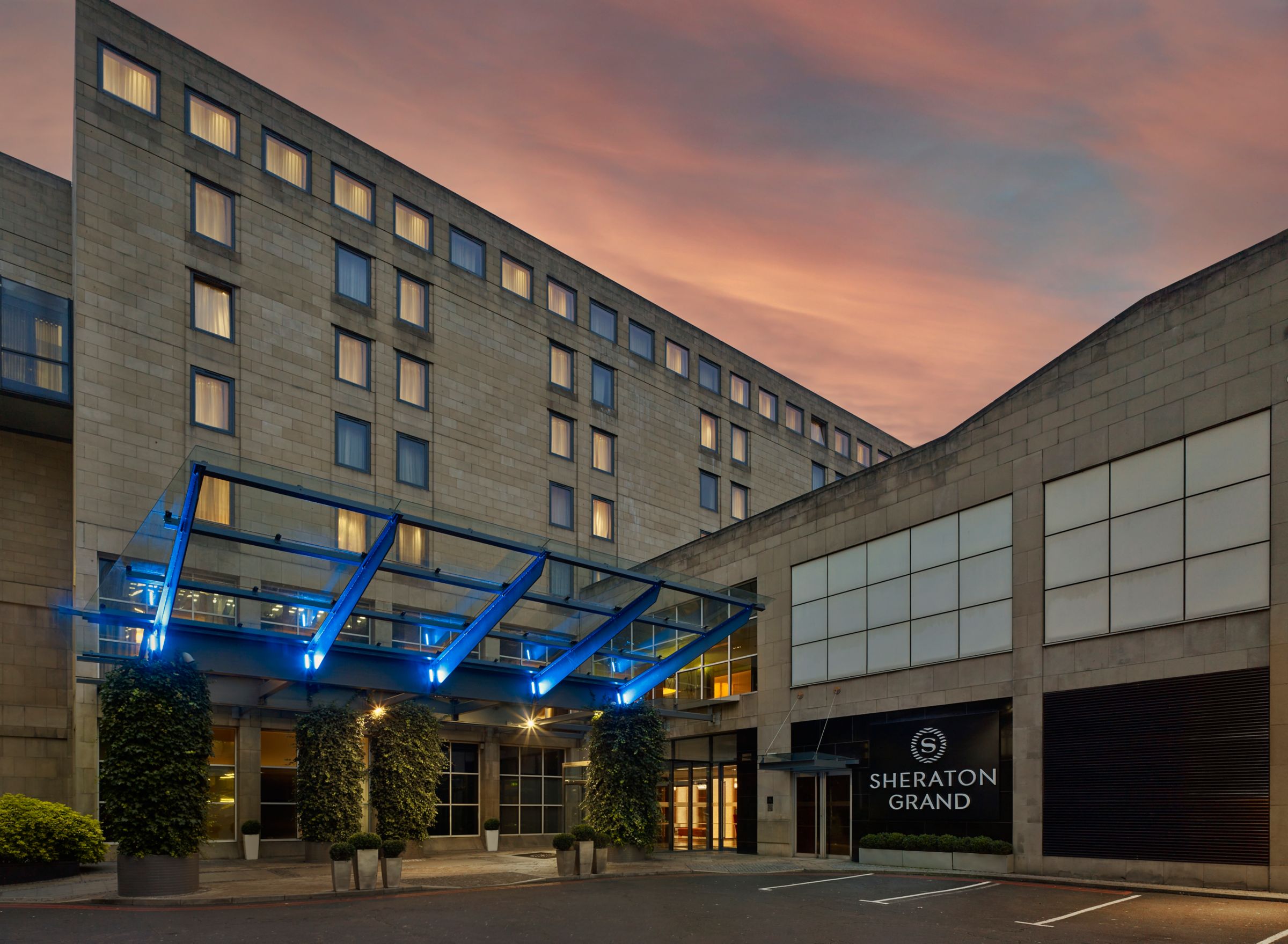 The hotel entrance on Festival Square at dusk, Sheraton Grand Hotel & Spa, Edinburgh