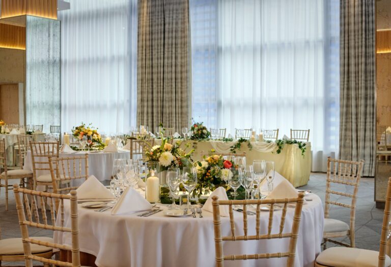 Round tables with floral centrepieces for the wedding breakfast, Sheraton Grand Hotel & Spa, Edinburgh
