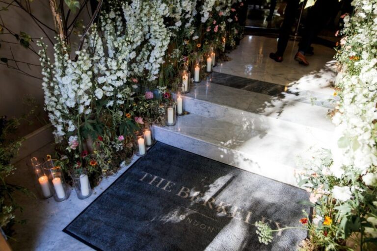 Candlelit florals line the entrance at The Berkeley, London, Shilpa Reddy