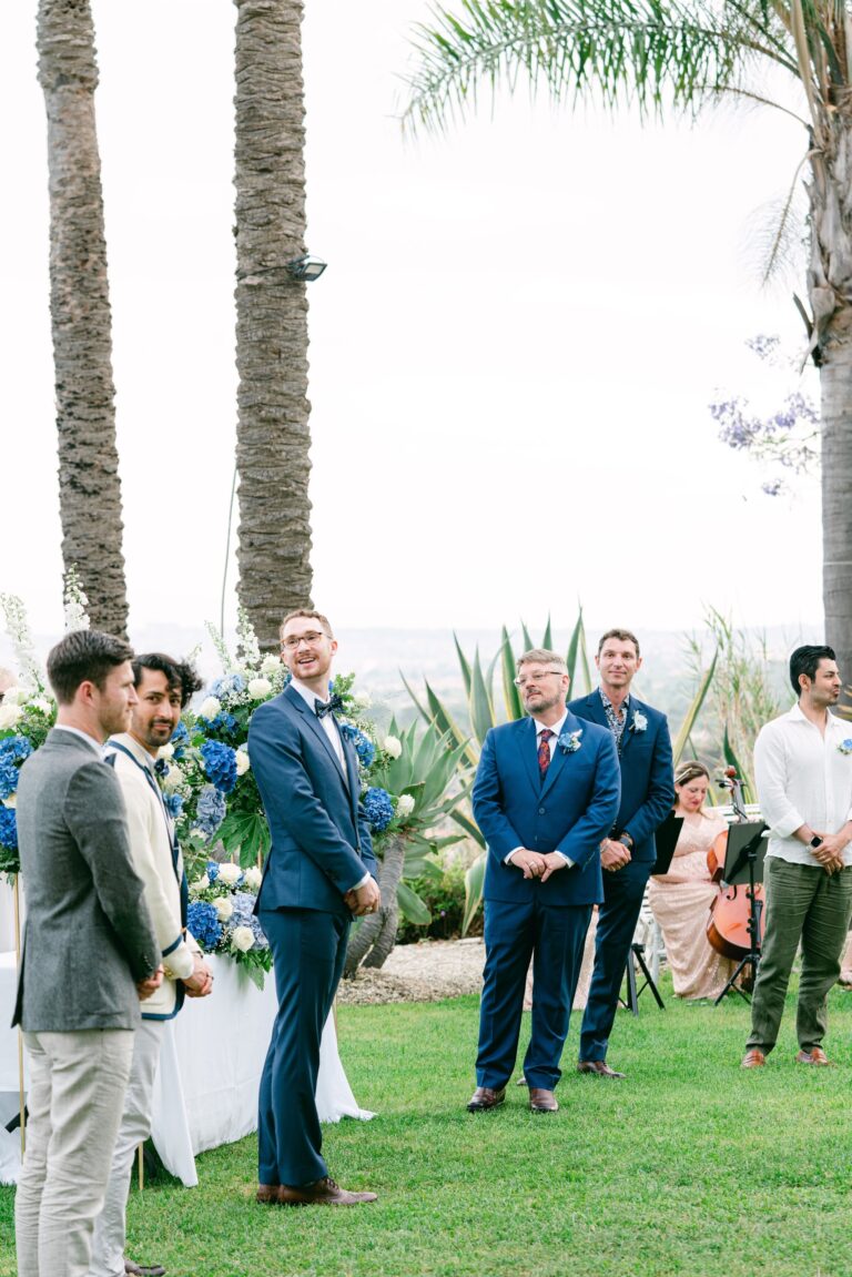 The ceremony on the lawn, palms overhead and hydrangea at the front, Sicilian Wedding Day