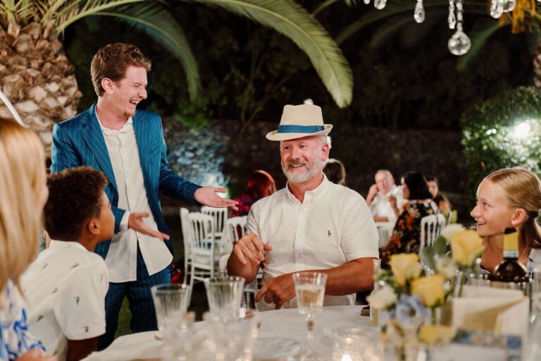 The long table at night under palms, a magician working between the courses, Sicilian Wedding Day