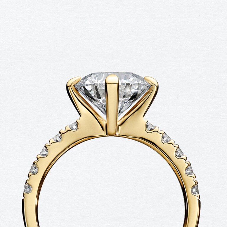 Round diamond solitaire engagement ring with a pave-set band in yellow gold, Sif Jakobs