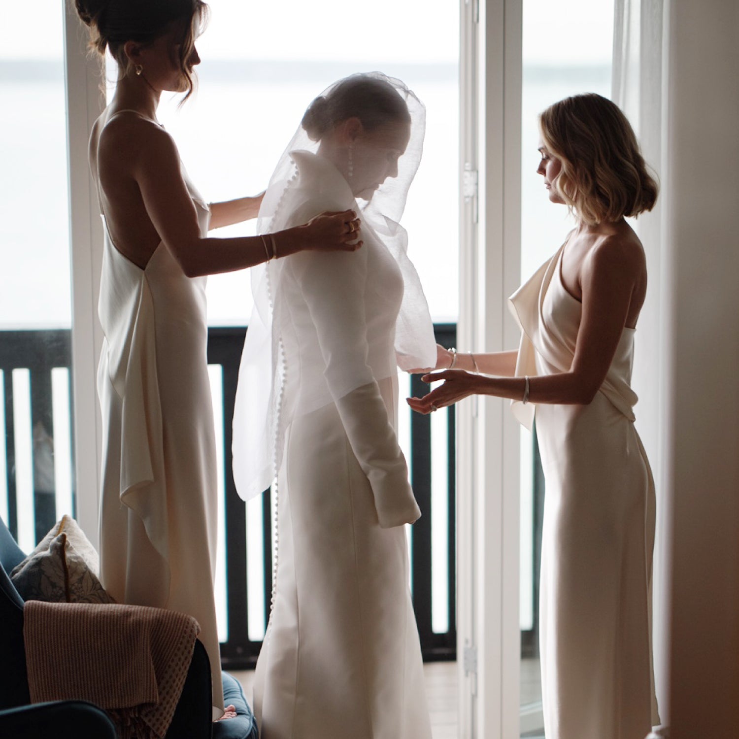 A bride is helped into her veil on the morning of the wedding, Sif Jakobs
