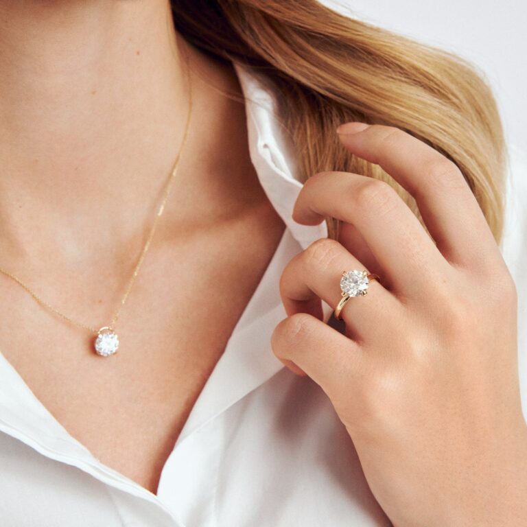 A diamond solitaire ring and pendant worn together, Sif Jakobs