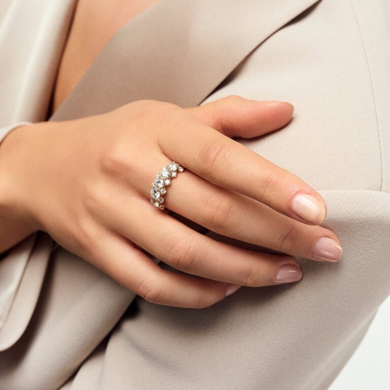 A cluster diamond ring worn with a soft neutral jacket, Sif Jakobs