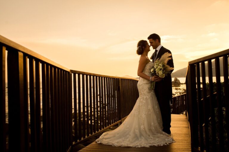 Couple on a timber walkway at sunset, Silavadee Pool Spa Resort