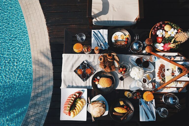 Breakfast spread laid out beside the pool, Silavadee Pool Spa Resort