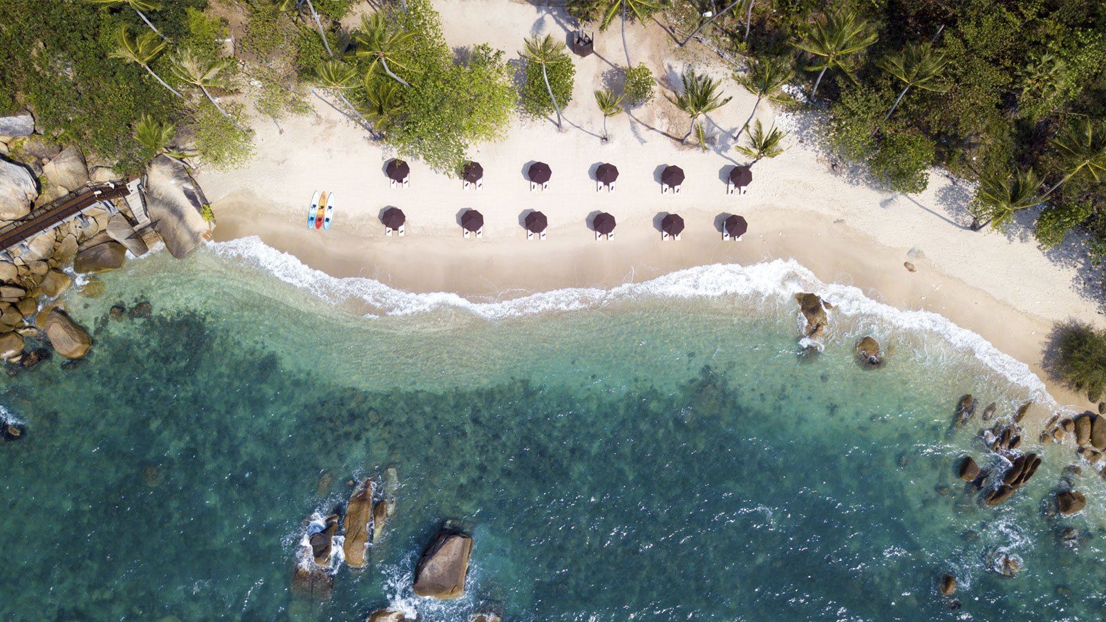Aerial view of the private beach, with sun loungers lined along the sand, Silavadee Pool Spa Resort