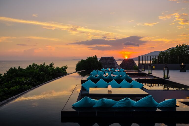 Sunset over the sea from the edge of an infinity pool, Silavadee Pool Spa Resort