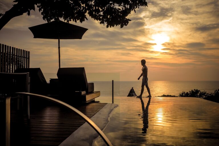 Silhouette at sunset beside the infinity-edge pool, Silavadee Pool Spa Resort