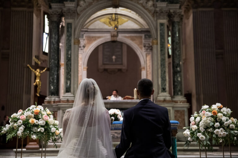 Bride and groom before the altar at the church of S. Alessio, Rome, Silvia Cleri Photography