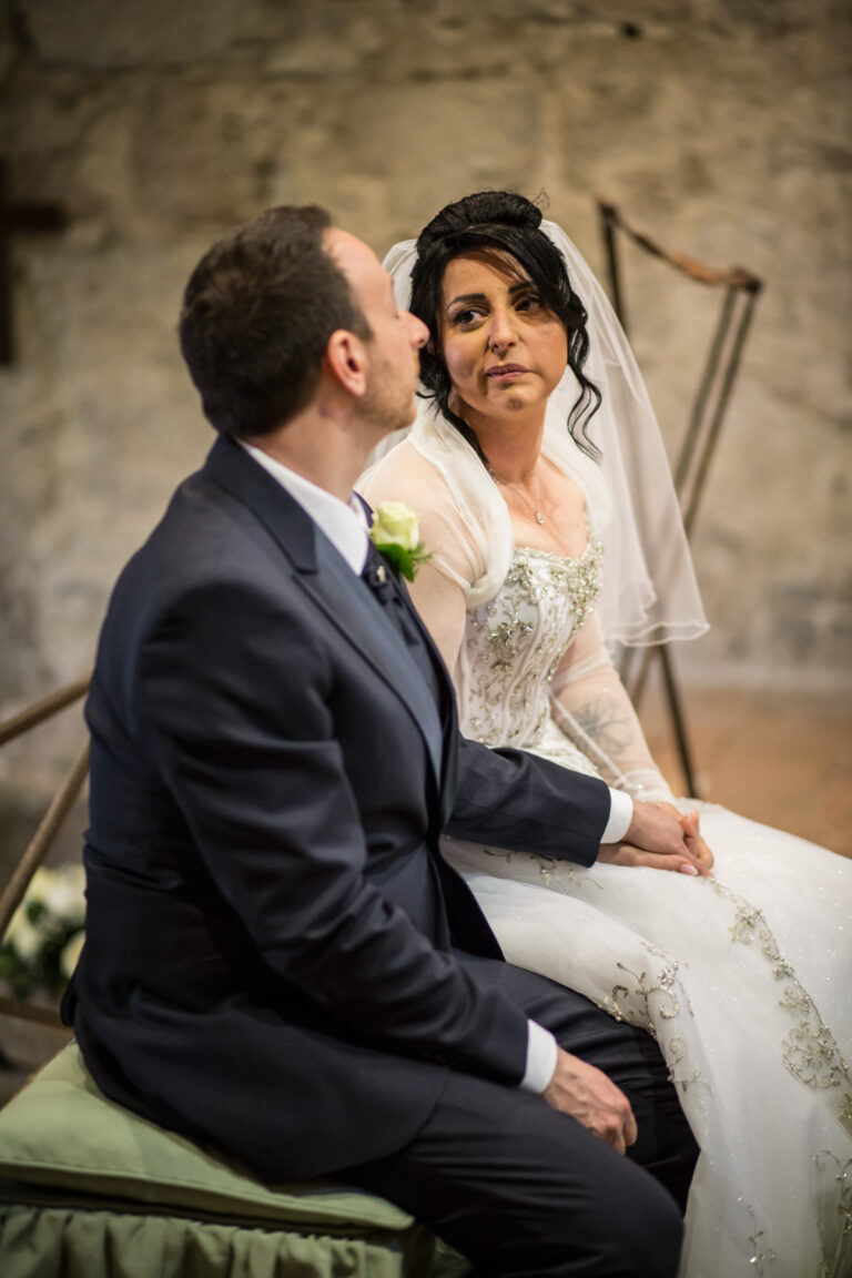 Bride and groom seated during the ceremony at Tenuta San Liberato, Lake Bracciano, Silvia Cleri Photography