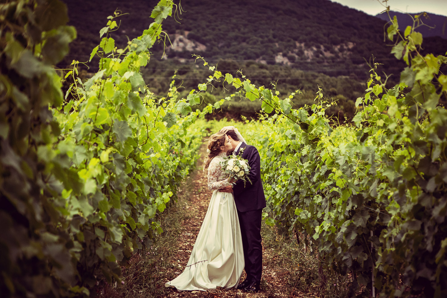 The couple between the vines at Reale Castel di Sangro, a former 16th-century monastery in Abruzzo, Silvia Cleri Photography