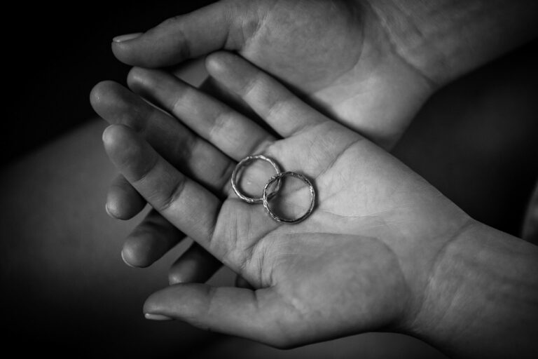 The wedding rings in an open palm, Tenuta Dell'Olmo, Silvia Cleri Photography