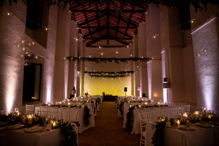 The candlelit reception hall set for dinner at Tenuta Pantano Borghese, Silvia Cleri Photography
