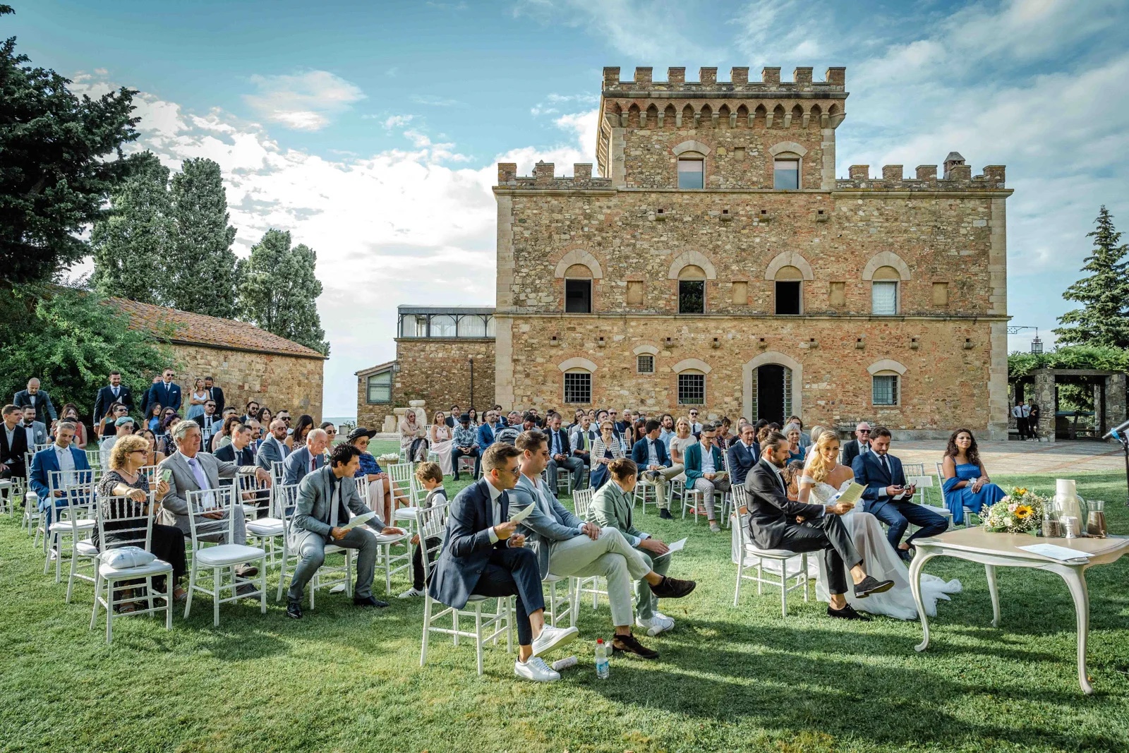 A garden ceremony on the lawn in front of Castello dei Segalari, Simone Perini Photography