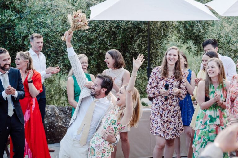 Cheers for the bouquet catch at Anke and Victor's wedding at Castello del Trebbio, Simone Perini Photography