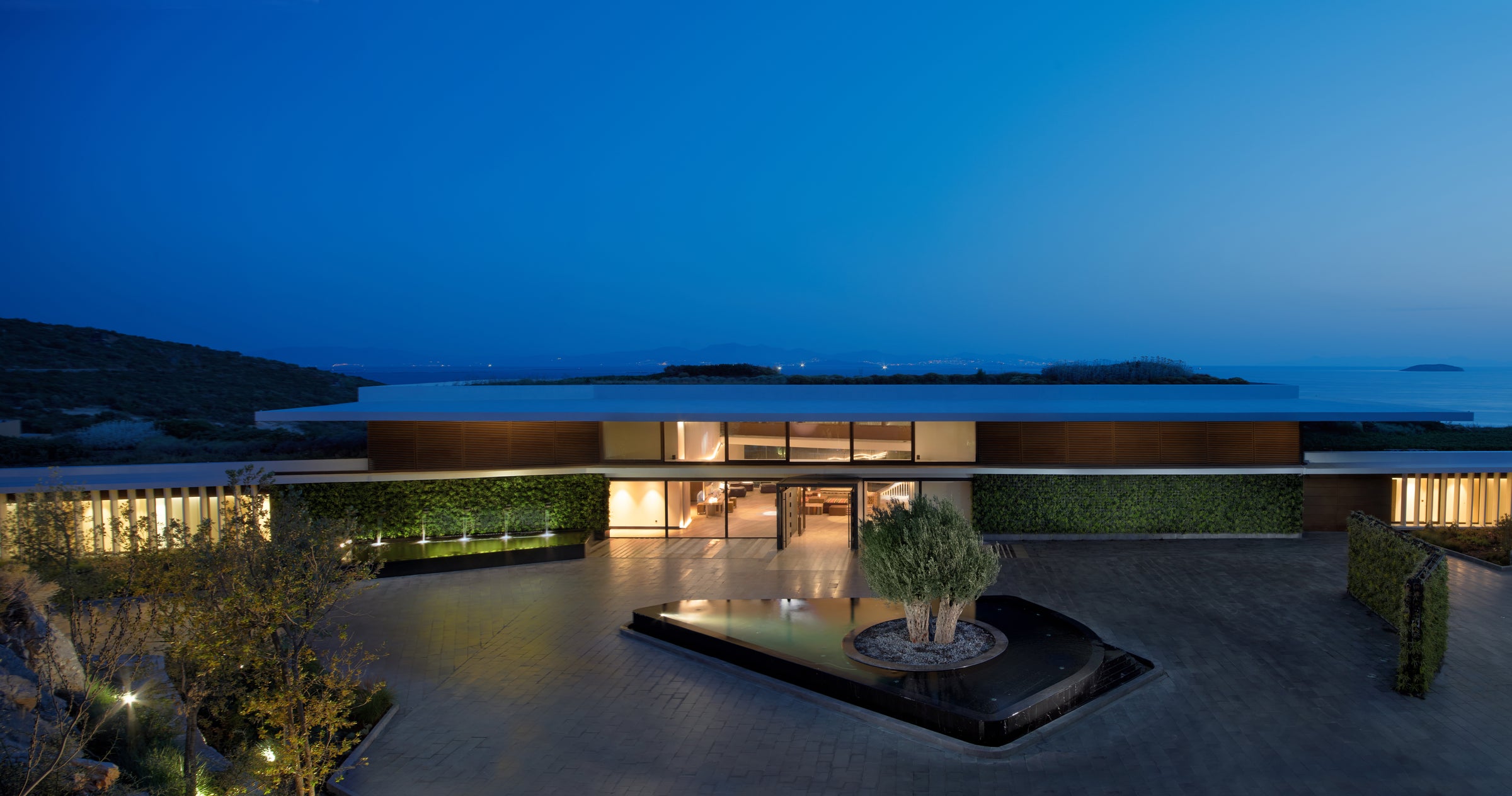 Main building entrance with vertical gardens at twilight, Six Senses Kaplankaya